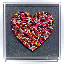 Load image into Gallery viewer, Pill Heart on Holographic Silver Ribbon Base, 12x12” frame