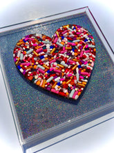 Load image into Gallery viewer, Pill Heart on Holographic Silver Ribbon Base, 12x12” frame